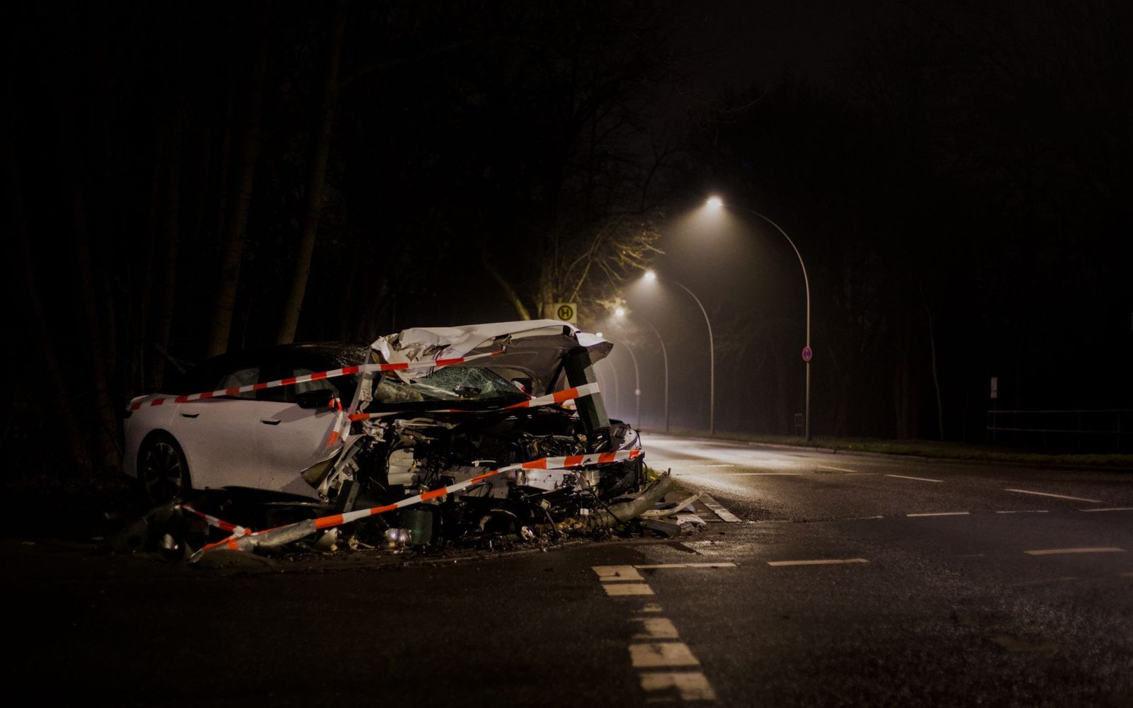 A damaged car sits on a dimly lit street after a crash at night.

Note: the stock photo is described as set in Berlin, but the page is about Cobb County, Georgia. I left the location out of the alt text because it isn't visible in the photo. If the image is a poor match for a Cobb County article, you may want a local photo instead.